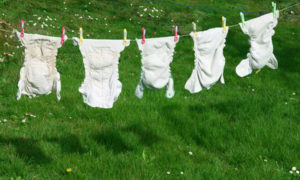 Reusable baby nappies on the line