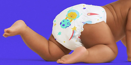 Baby crawling wearing cute disposable diapers from Kudos