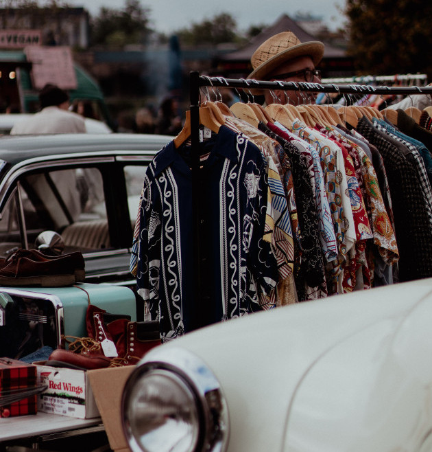 Clothes on a rail can be sold second hand in what is slow fashion industry